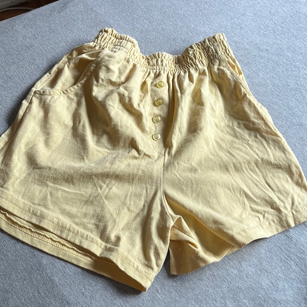 Yellow high waisted shorts with pockets